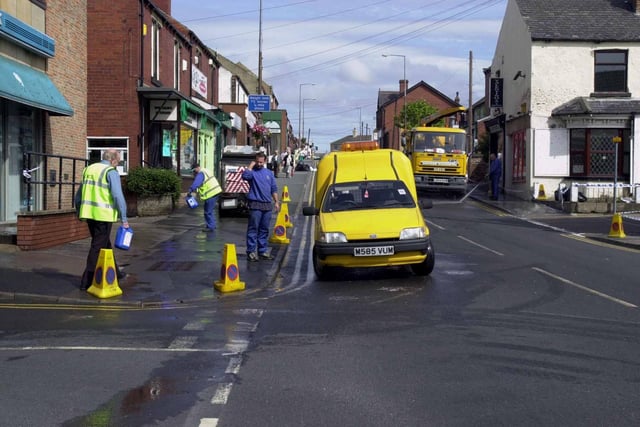 A clean -up operation on Garforth's Main Street in August 2000 after gallons of animal blood were spilt from a tanker