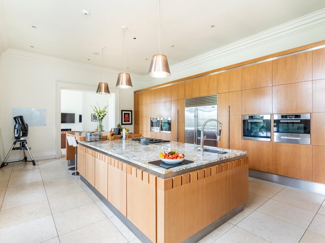 Furniture designer Neal Jones was commissioned to build the fitted library and magnificent kitchen.