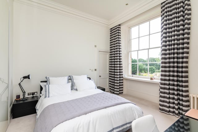 There are six generous bedrooms with en suite bathrooms, including the principal suite with its own morning room and dressing room.