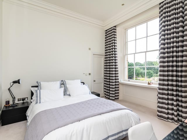 There are six generous bedrooms with en suite bathrooms, including the principal suite with its own morning room and dressing room.