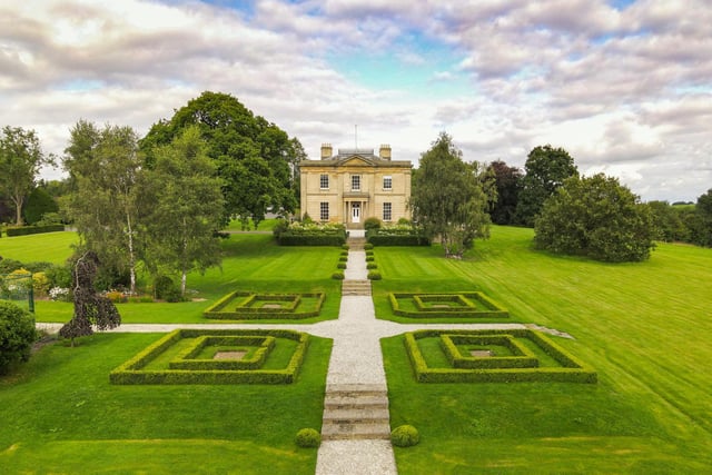A handsome Grade II listed Georgian manor house, occupying a discrete but commanding elevated position between the villages of Scarcroft and Thorner, is for sale.
