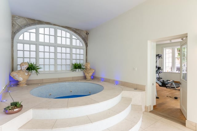 The jacuzzi has a beautiful window behind it allowing in plenty of natural light.