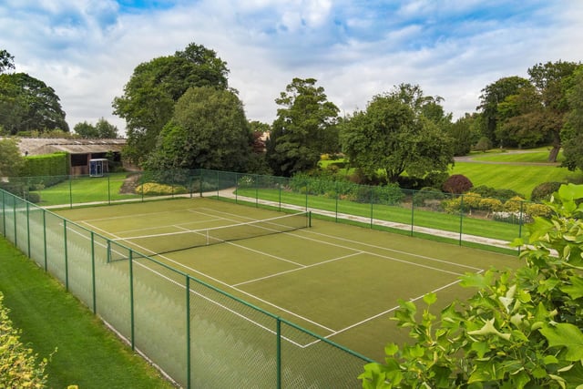 The bulk of the grounds lay to the south and west, the manicured lawns formed into gentle terraces, dissected by gravel pathways passing a parterre and leading down to an all weather tennis court and productive vegetable garden.