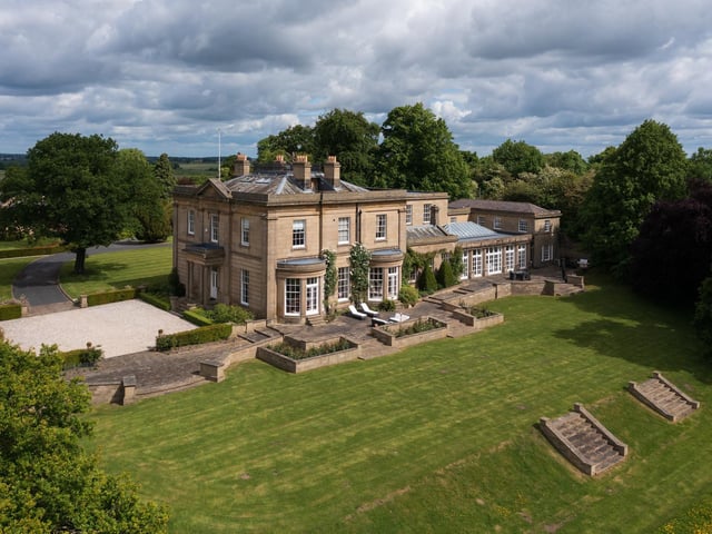 The lower garden, which extends to about 15 acres, is predominantly grassland providing ample grazing for horses or livestock, supported by a steel frame barn measuring approximately 116'x59', accessed via a separate driveway.