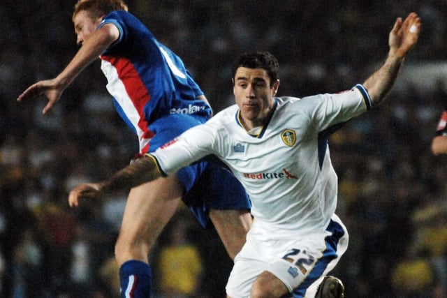 Andrew Hughes battles for the ball with Carlisle United's Chris Lumsden.