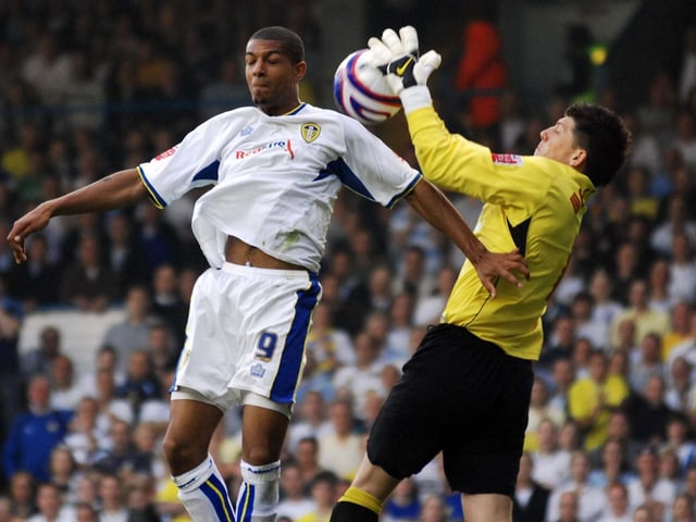Striker Jermaine Beckford challenges Carlisle United goalkeeper Keiren Westwood.