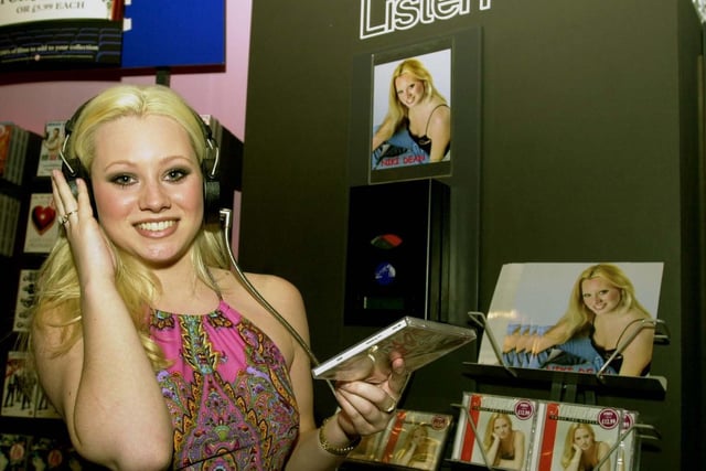 Niki Dean a former pupil at Intake High School, listens to her debut CD 'Cross the Battleline' at HMV in the city centre.