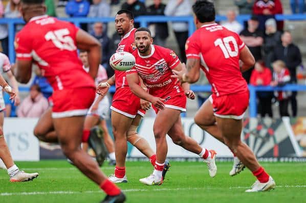 Kruise Leeming, playing for Combined Nations, gets a pass away to Rhinos teammate Zane Tetevano. Picture by Alex Whitehead/SWpix.com.
