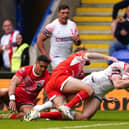 England's Jake Wardle dives in to score his side's first try against the Combined AllStars at the Halliwell Jones Stadium Picture: Martin Rickett/PA