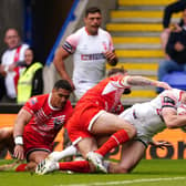 England's Jake Wardle dives in to score his side's first try against the Combined AllStars at the Halliwell Jones Stadium Picture: Martin Rickett/PA