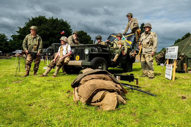 Pictured, from left, Howard Lister, Stuart Stevens, Steve Newton, Hewey Bennett, (driver) Paul McEvoy, Lee Stevens, dressed as members of the US 101st Airborne Division. Adrian Coulson, dressed as General Taylor, Division Commander of the 101st Airborne Division, keeps an eye on the troops.
