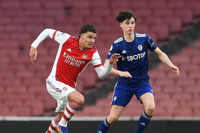 Archie Gray (R) vies for possession against Arsenal U23 player Omar Rekik (Photo by David Price/Arsenal FC via Getty Images)