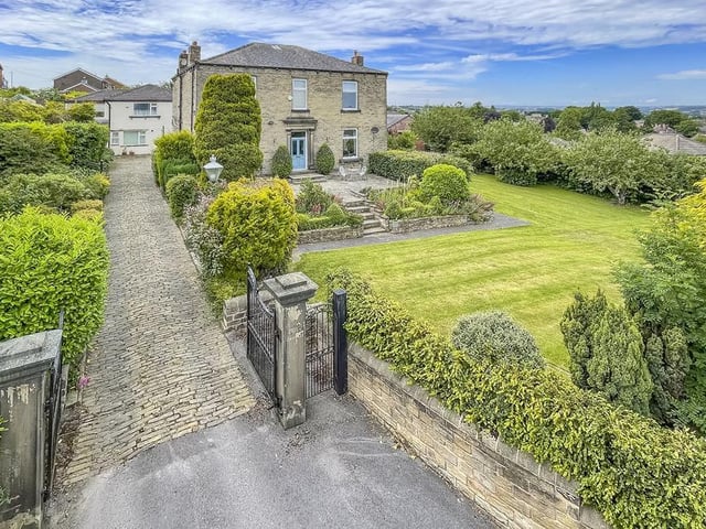 Oakville has a private driveway and private, enclosed gardens with lawns, trees and foliage.
