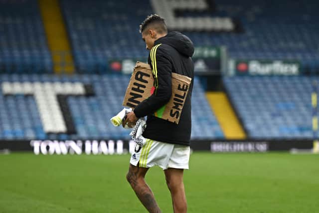 SOLO: Raphinha trudges off at Elland Road following the Whites' final home game of the 2021/22 season (Photo by OLI SCARFF/AFP via Getty Images)