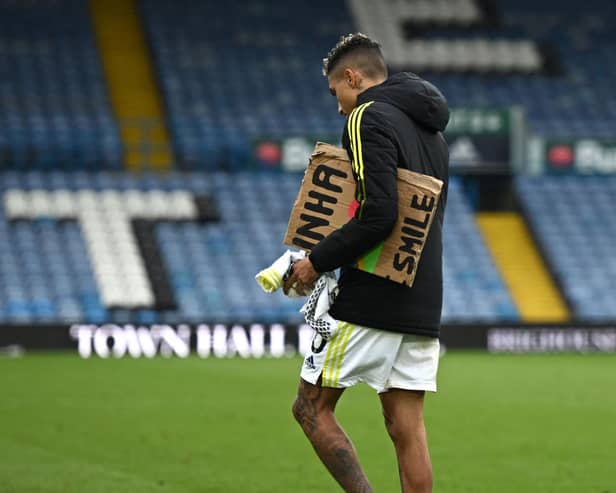 SOLO: Raphinha trudges off at Elland Road following the Whites' final home game of the 2021/22 season (Photo by OLI SCARFF/AFP via Getty Images)