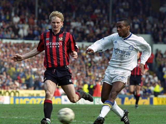 Rod Wallace fires towards goal as David May closes in.
