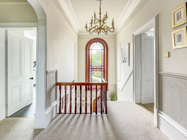 This stained glass window is an original feature of the house.