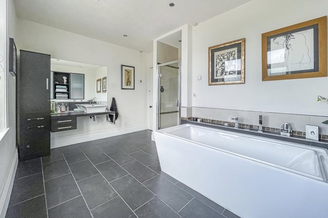 Large and luxurious are keywords for this sleek family bathroom.