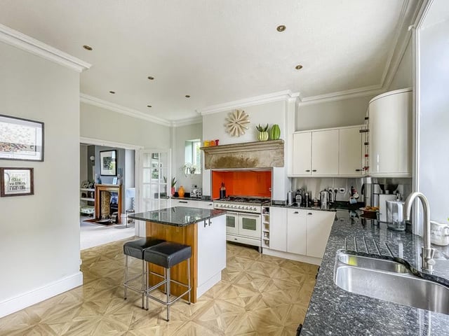 An island with breakfast bar is one feature within this open plan facility.