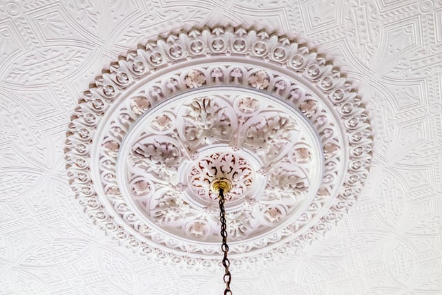 This ceiling rose is one notable feature within the ground floor rooms.