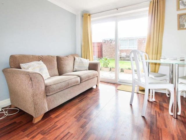The property comprises of a spacious entrance hall, living room with under stairs storage cupboard, separate dining room with patio doors, fully fitted kitchen, three first floor bedrooms, and a family bathroom.
