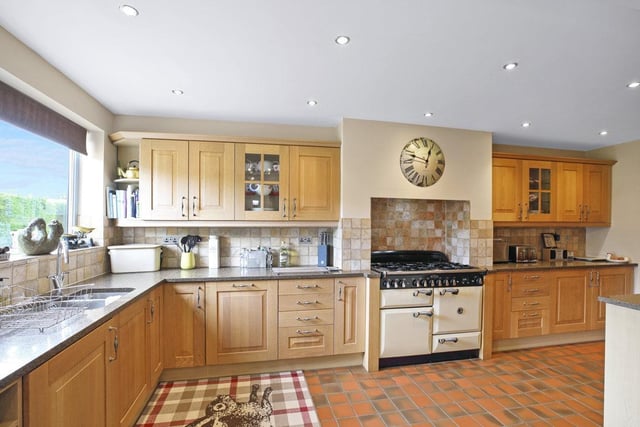 The kitchen is equipped with a range of integrated appliances.
