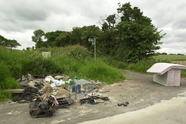 A freephone number was launched to report fly tipping in the countryside. Pictured are abandoned beds and debris on Leeds Lane at Garforth.