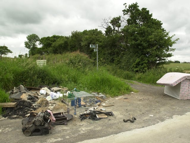 A freephone number was launched to report fly tipping in the countryside. Pictured are abandoned beds and debris on Leeds Lane at Garforth.