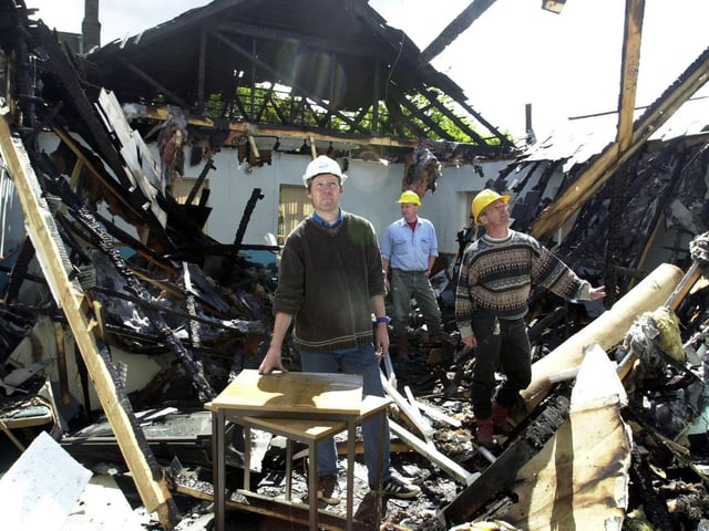 St James Church on Low Lane at Horsforth was devastated by fire. Pictured, from left, are church members John Evans, Chris Webb and Rob Newby looking at the damage.