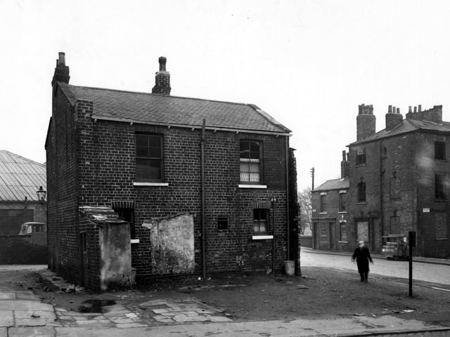The back Jacob Street, looking north east across Camp Road in March 1956. A man walks towards the camera.