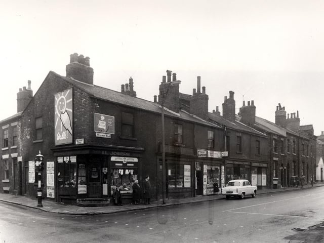 The junction of Meanwood Street and Meanwood Road in April 1958. The corner shop was the business of I.L. Joseph, selling boots and shoes. Resting against the window is a member of the Higgins family, who kept a fish mongers shop on Meanwood Road.