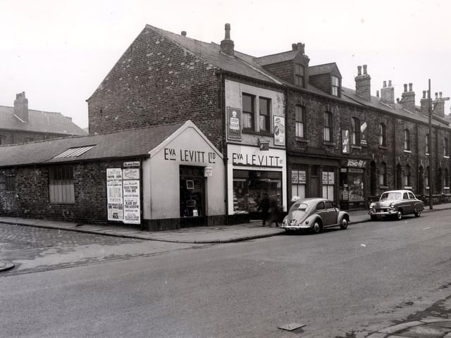 Meanwood Road in April 1958 and in focus are the premises of Eva Levitt Ltd, china and hardware dealer. Moving right is the Paper Trading Company, Leeds Ltd. Then a grocers shop. Delaware Street is on the left.