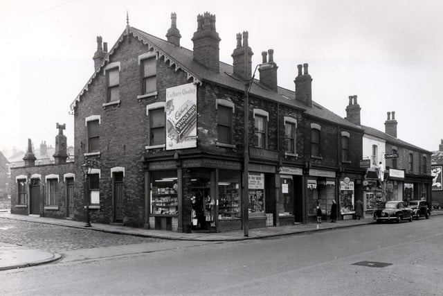 April 1958 and the shop at the corner of Meanwood Road, selling a variety of cheap goods, is Borlants Bargains. Next is George Higgins fish monger.