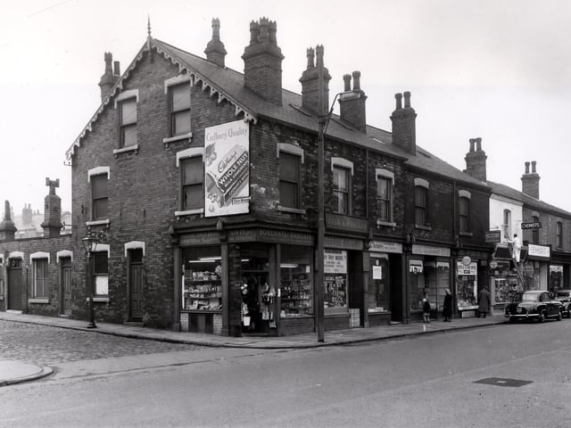 April 1958 and the shop at the corner of Meanwood Road, selling a variety of cheap goods, is Borlants Bargains. Next is George Higgins fish monger.