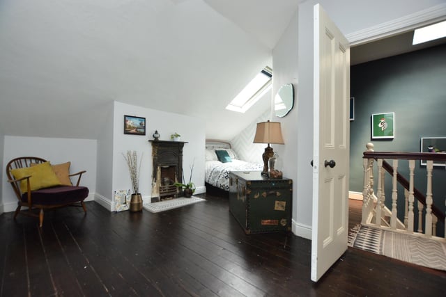 The second floor has two bedrooms, both with cast iron fireplaces and a boxroom for storage.