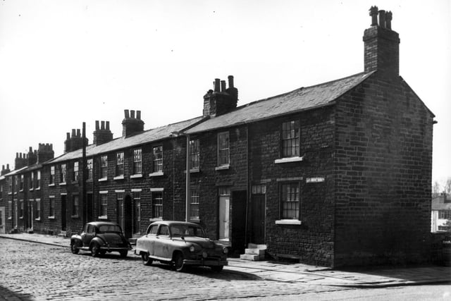 This view looks across Methley Drive onto stone built houses on the odd numbered side on Union Terrace in March 1967.