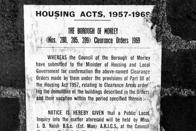A notice on the wall of a house on Parker Street in East Ardsley in December 1970.  It advertises a public inquiry into the demolition of the buildings to be held in the Council Chamber at Morley Town Hall.