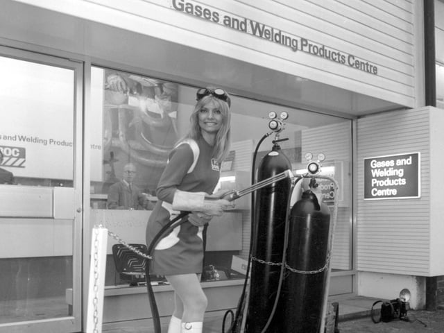 Miss BOC Swedish model Ischi Bernell is pictured opening a new welding product centre at the British Oxygen works in Leeds by cutting a chain with a flame cutter in January 1970.
