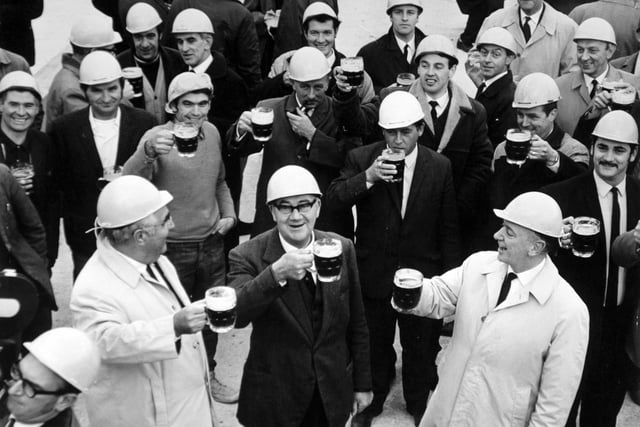 Drinking the traditional toast at the topping out of the new Yorkshire Evening Post headquarters on Wellington Street.