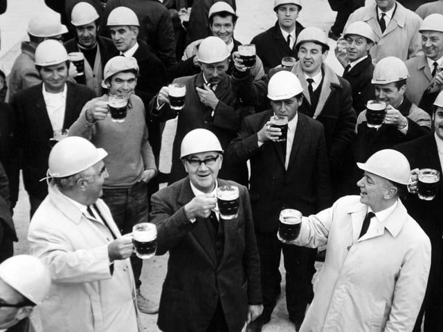 Drinking the traditional toast at the topping out of the new Yorkshire Evening Post headquarters on Wellington Street.