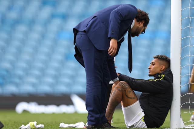 DISCUSSION: Leeds director of football Victor Orta converses with Raphinha following Leeds' final home game of 2021/22 (Photo by Robbie Jay Barratt - AMA/Getty Images)