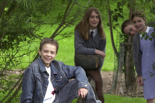 Coronation Street star Jack P. Shepherd, left, who played teenage tearaway David Platt, is pictured in the sensory garden at the Holy Name Catholic Primary School.  Pictured with pupils, from left, Rosie Deacon, Matthew DiClemente, Robyn Deacon and Louis Ellis.