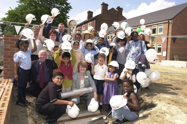 Youngsters from Leopold Primary bury a time capsule at a housing development on Leopold Street in Chapeltown.