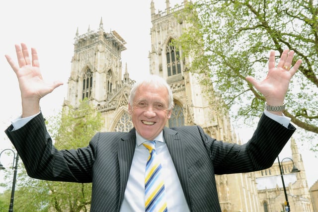 Harry Gration celebrates being awarded the MBE outside York Minster in 2013
