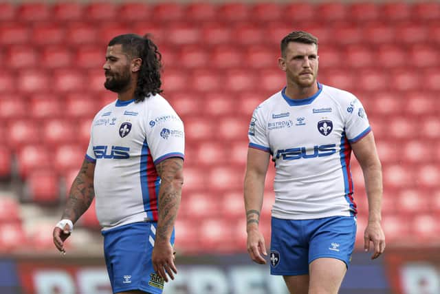 Dejected Wakefield Trinity duo David Fifita, left, and Lee Gaskell after Sunday's heavy Super League defeat at Salford Red Devils. Picture: Paul Currie/SWpix.com.