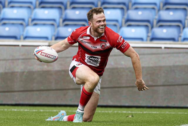 Salford Red Devils' Joe Burgess scored a hat-trick of tries in Sunday's 74-10 home Super League win over Wakefield Trinity. Picture: Paul Currie/SWpix.com.