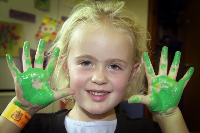 Kate Naylor makes hand prints at the paint and play fun day at Morley Leisure Centre in August 2001.