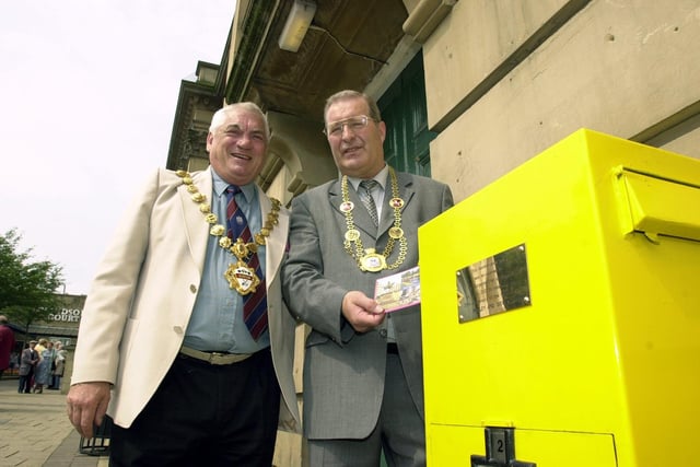 BŸrgermeister of Siegen Ulf Stotzel (right) posts a postcard back home in the re-opened German postbox in Morley to celebrate 35th anniversary of the town's twinning. He is pictured with Morley Mayor Frank Tighe watching on in July 2001.