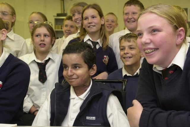 Bruntcliffe High School Hashim Dharma who received the Diana Princess of Wales Memorial Award for Bravery through his ongoing illness. He is pictured with some of his close friends from his class in July 2001.