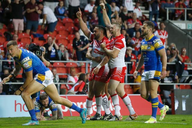 Aidan Sezer, right, watches on as Konrad Hurrell, Saints player on left, celebrates a try against Rhinos. Picture by Ed Sykes/SWpix.com.